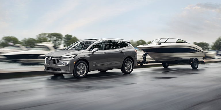 2023 Buick Enclave pulling a boat with the available trailer hitch