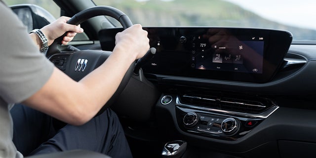 Driver behind the wheel of a Buick Envista