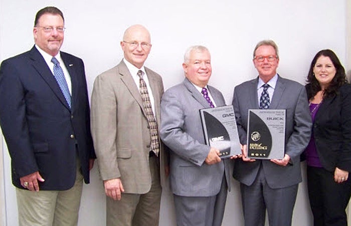 Paul Aardal, District Manager Aftersales; Ron Meier, Zone Manager-BG Ohio; Ed Babcock, President/Owner; Mike Butler, Junction Buick GMC Named Mark of Excellence Dealer by General Motors! Sales Manager; Melissa Principe, District Sales Manager.