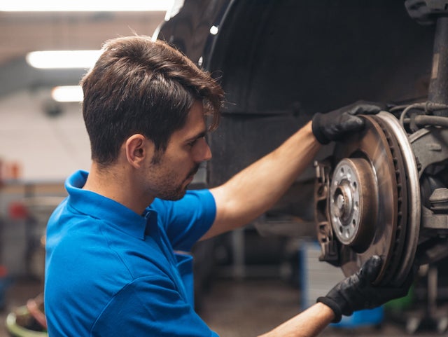 A Service Technician inspecting a rotor